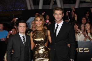 LOS ANGELES, MAR 12 - Josh Hutcherson Jennifer Lawrence Liam Hemsworth arrives at the Hunger Games Premiere at the Nokia Theater at LA Live on March 12, 2012 in Los Angeles, CA photo