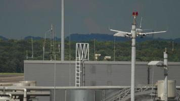 DUSSELDORF, GERMANY JULY 23, 2017 - Boeing 737 of SunExpress airline landing at Dusseldorf International Airport, Germany. Airliner landing on a hot day. View through the haze video