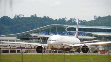 PHUKET, THAILAND NOVEMBER 27, 2017 - Boeing 777 of Aeroflot taxiing on apron Phuket airport. Widebody board at the airport terminal. Tourism and travel concept video