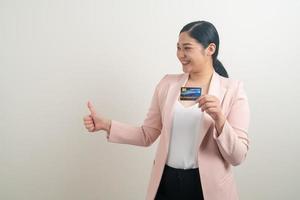 Asian woman holding credit card with white background photo