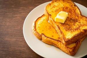 French toasted with butter and honey photo