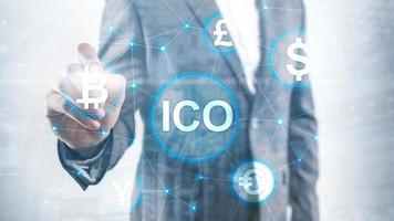 ICO - Initial coin offering, Blockchain and cryptocurrency concept on blurred business building background. photo