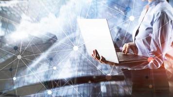 Blockchain network on blurred skyscrapers background. Financial technology and communication concept photo