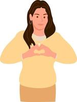 Smiling young girl in a yellow sweater showing a heart with both hands, a sign of love vector