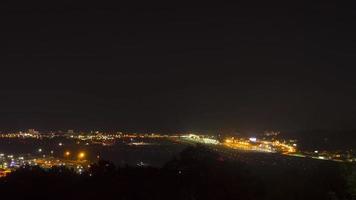 Generic airport timelapse with lights from moving airplanes landing taxiing and taking off at Sochi. Tourism and travel concept video