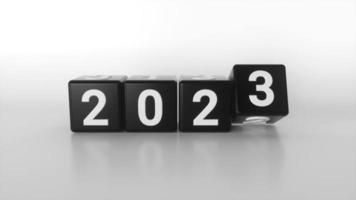Transição do conceito de ano novo de 2022 para 2023 com cubos pretos ou blocos em fundo branco. alterar calendário. balcão de estilo minimalista. modelo 3D video