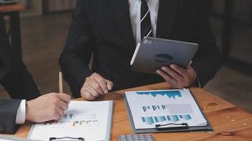 Businessman working with smart phone and laptop and digital tablet computer in office with digital marketing media in virtual icon video