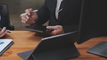 Businessman working with smart phone and laptop and digital tablet computer in office with digital marketing media in virtual icon video