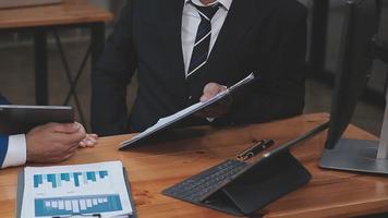 Businessman working with smart phone and laptop and digital tablet computer in office with digital marketing media in virtual icon video