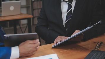 Businessman working with smart phone and laptop and digital tablet computer in office with digital marketing media in virtual icon video