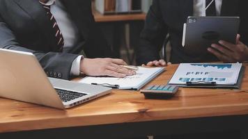 Businessman working with smart phone and laptop and digital tablet computer in office with digital marketing media in virtual icon video