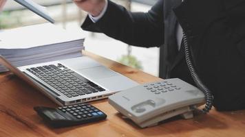 Businessman working with smart phone and laptop and digital tablet computer in office with digital marketing media in virtual icon video