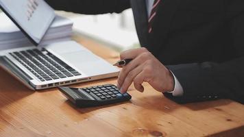 Businessman working with smart phone and laptop and digital tablet computer in office with digital marketing media in virtual icon video