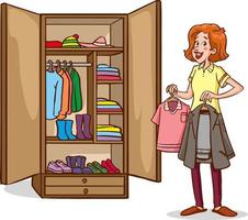 Mujer joven y bonita colgando vestidos en el armario en el dormitorio en casa vector