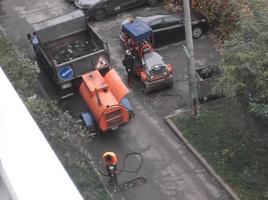 KIEV, UKRAINE - OCTOBER 24, 2022 Road works carry out repairs with machinery photo