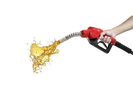 Petrol splashing out of pistol, isolated on white background photo