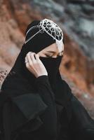 Muslim Woman Pose at the Desert, Close-Up photo