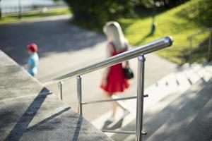 Handrail on stairs in park. Steel handrail. Element of park architecture. photo