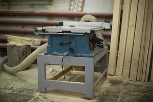 Board sawing machine. Joinery. Electrical equipment in garage. photo