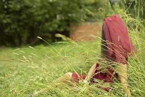 Girl on lake. Girl in dress in park. Outdoor recreation in summer. photo