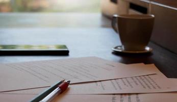 proofreading paper on table photo