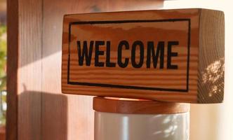welcome english word on wooden block photo