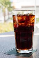 glass of soft drink with summer view photo