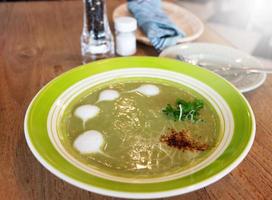 green spinach soup on table photo