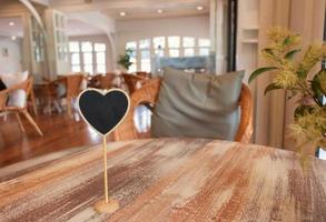 empty sign on wooden table in coffeehouse photo