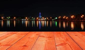 perspective wooden board over cityscape photo
