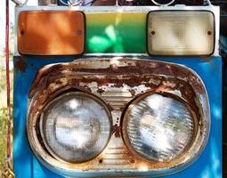 worn out headlight of Thai car photo