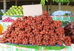 fresh salacca on shelf in market photo