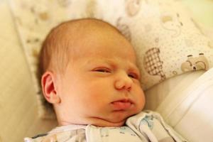 Portrait of cute sleeping newborn baby on her bed. photo