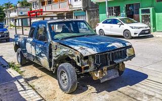 Playa del Carmen Quintana Roo Mexico 2022 Broken scrap tire rustic cars car Playa del Carmen Mexico. photo