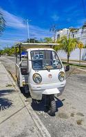 Playa del Carmen Quintana Roo Mexico 2022 White tuk tuk white TukTuks rickshaw in Mexico. photo