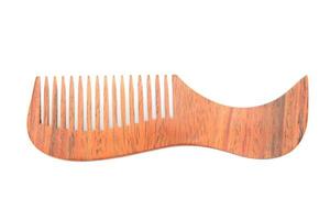 wooden comb isolated on white background photo