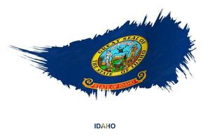 Flag of Idaho state in grunge style with waving effect. vector