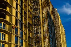 demolition of a multi-storey building. a large concrete house with glass windows is about to be demolished. destruction of high-rise buildings. creating additional space for building a house photo