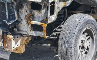 Broken scrap tire rustic cars car Playa del Carmen Mexico. photo