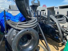 A large pump with an impeller and an impeller stands in a storage warehouse prepared for installation of industrial metal equipment for an oil refinery and petrochemical plant photo