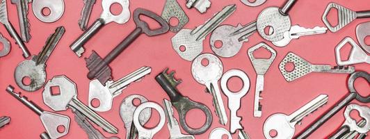 Keys set on pink background. Door lock keys and safes for proper photo