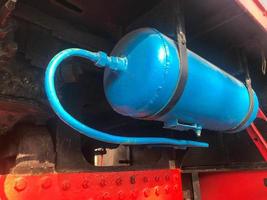 Large blue iron metal cylindrical industrial tank. Gas cylinder for storage of liquefied gas under pressure photo