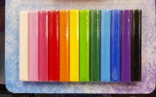 Colorful crayon or chalk on packaging for sale at stationery store. Group of Art object or retail and Color pattern. photo