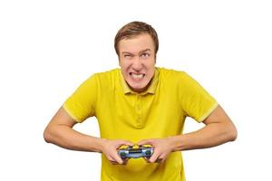 Funny handsome gamer with gamepad, excited video game player isolated on white background photo