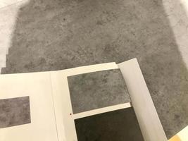 samples of gray materials for creating furniture. examples of gray shades for painting facades. wooden cabinets in different colors. stylish sleek material. gray graphite texture photo