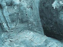 bright strokes of paint. acrylic strokes. blue paint texture with an admixture of pastel colors, large volumetric strokes. abstract texture. point brush strokes. layering paint on canvas photo