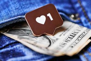 Like heart symbol and dollar in jeans pocket photo