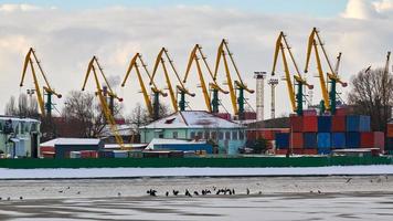 Harbor cranes, container ship terminal, cargo container yard photo