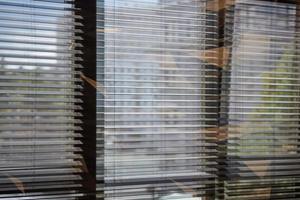 Office blinds. Modern wooden jalousie. Office meeting room lighting range control. photo