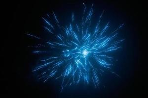 Blue night fireworks colorful bright sparkles and shiny festival explosion, glittering of sky fire photo
